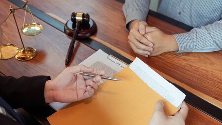 Male Notary lawyer or judge consult or discussing contract papers with Businessman client in office,...