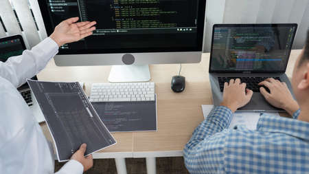 Asian Outsource Software engineer Developer Team Working Code to find solution to problem In Modern Office, Startup business group working as team conceptの写真素材