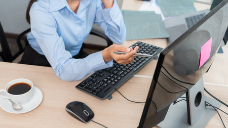 Asian woman programmer typing source code with computer pc for Developing program or application in...
