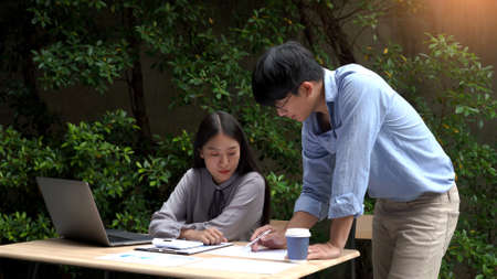 Working outdoor concept a female officer talking with her supervisor to solve the problems of the...