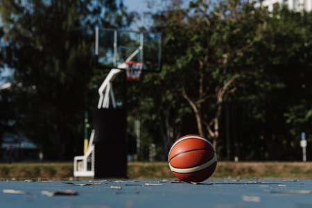 Sports and recreation concept a round basketball laying down on the floor of a basketball court.の写真素材