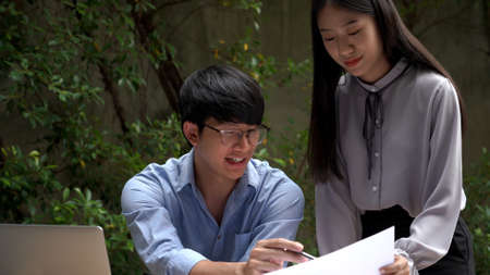 Working outdoor concept a female officer talking with her supervisor to solve the problems of the...
