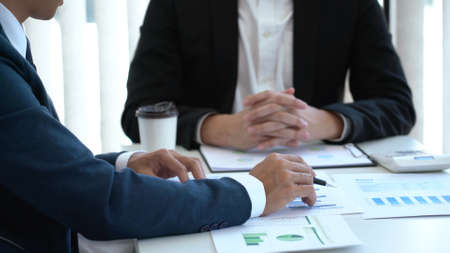 Business concept a male sale representative explaining the information of the companyâs sale to a male clientの写真素材