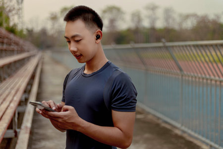 Sports and recreation concept a male adolescent doing warm-up movements as raising his body...