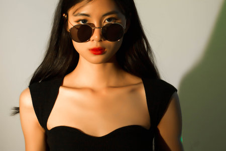Fashion and beauty concept, Portrait of fashion woman with glowing makeup and wearing sunglasses.の写真素材