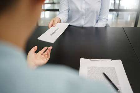 Concept of leaving job, Female employee sending resignation letter to executive when quit job.の写真素材
