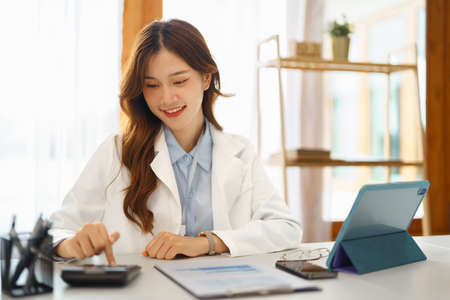 Successful business concept, Businesswoman is calculated investment to thinking about new project.