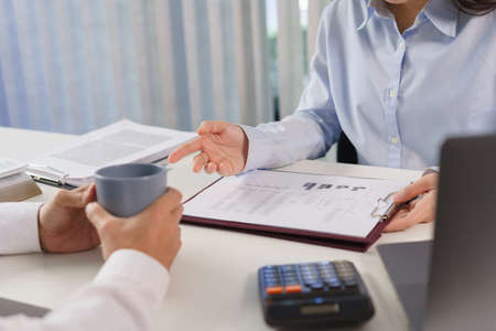 Business concept, Business colleague explain marketing data to partner while talk about investment.