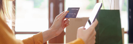 Business at home concept, Asian woman is typing credit card data on smartphone to shopping online.の写真素材