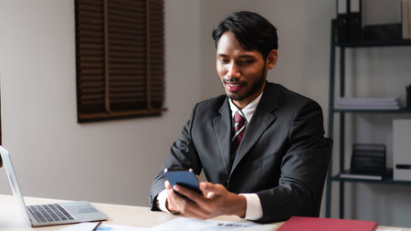 Businessman using smartphone to researching data and analyzing strategy of startup business project.の写真素材