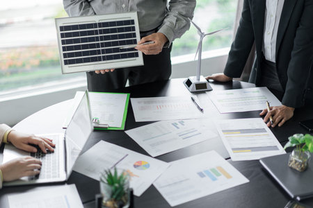 Alternative energy environment business team discuss about solar cell panel and document of project.の写真素材