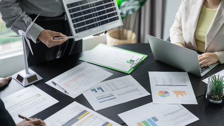 Alternative energy environment business team discuss about solar cell panel and document of project.の写真素材