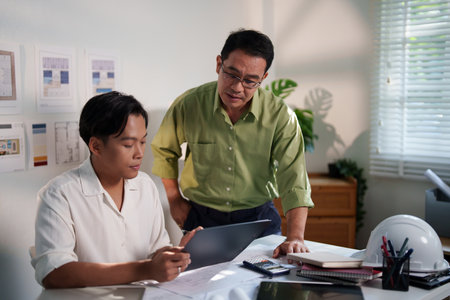 A detailed discussion between engineers about building requirements and material optimization for a...