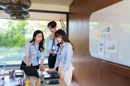 Focused young startup team brainstorming innovative business strategies, collaborating on a project,...
