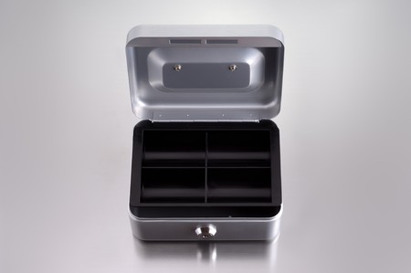 opend cash box on metalic backgroundの写真素材