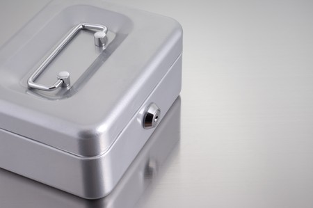 metal cash box on metallic backgroundの写真素材