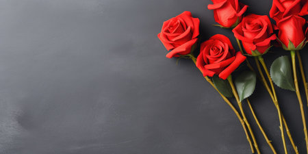 Red roses on black background with copy space. Valentines day backgroundの素材