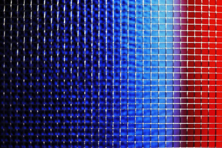 abstract background of a metal grid with blue and red stripes.の素材
