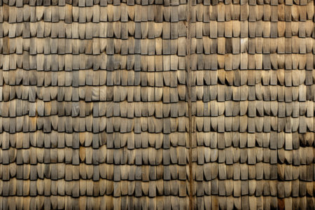 close up of the roof of a house made of wood and bambooの素材