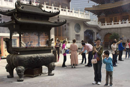 People Practicing Buddhism at Jing An Temple in Shanghaiのeditorial素材