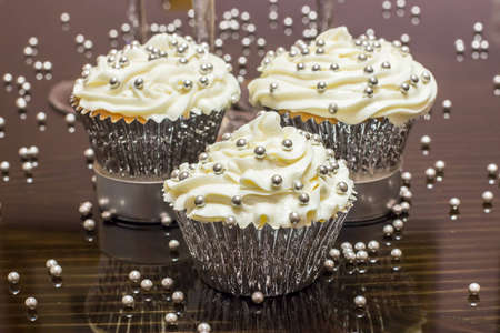 White cupcake with silver decorationsの写真素材