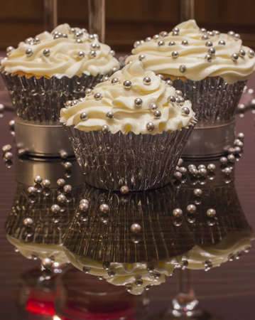 White cupcake with silver decorationsの写真素材