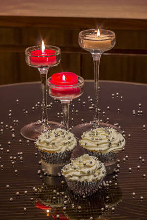 White cupcake with silver decorationsの写真素材