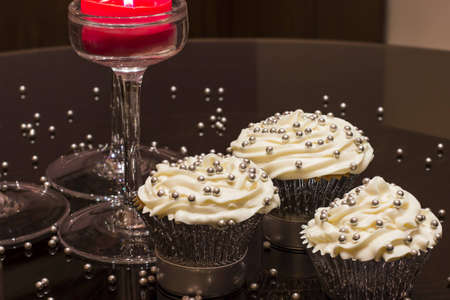 White cupcake with silver decorationsの写真素材