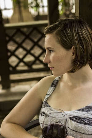 Woman relaxing with wineの写真素材