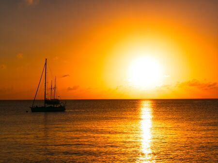 Sailing into the Golden sunsetの写真素材