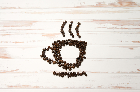 A cup of steaming espresso made out of fresh coffee beansの写真素材