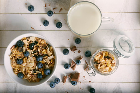 healthy breakfast with milk composition blueberry cereals and choccolateの写真素材