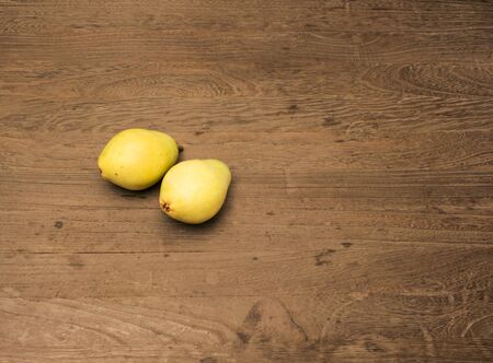 pear on wood tableの写真素材