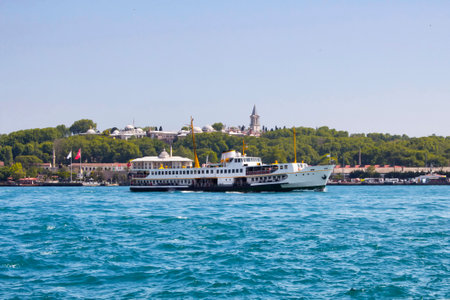 Public ferry passes in front of Topkapi Palace in Istanbulのeditorial素材