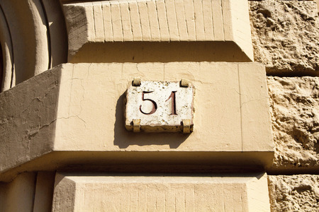 Engraved building number in Romeの写真素材