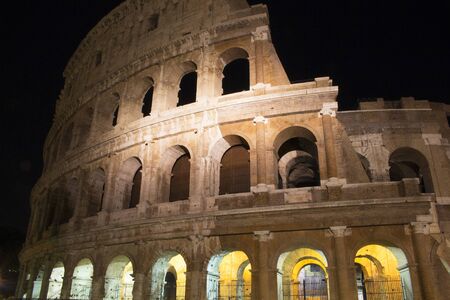 View of illuminated Colosseum at night in Romeの写真素材