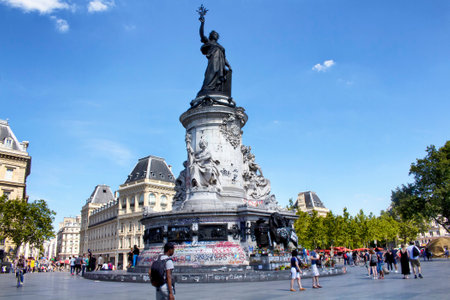 PARIS - JULY, 2016: View of statue Andre Tollet at republic square in Paris. People hang out around it.のeditorial素材