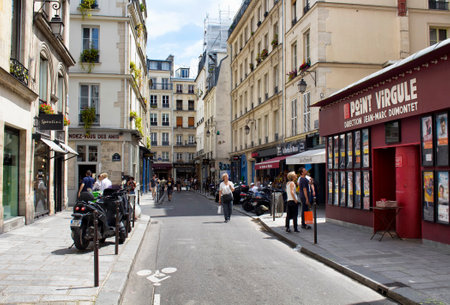 PARIS - JULY, 2016: People walk on one of streets of Le Marais district of Paris. This area are full of artisan boutiques, restaurants, cafes.のeditorial素材