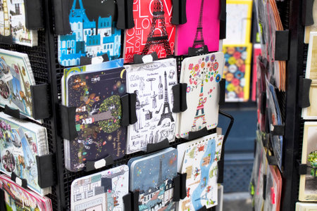 PARIS - JULY, 2016: Close up view of French postcards on racks about Paris with illustrations on Rue Montorgueil street.のeditorial素材