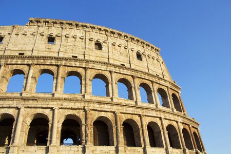 Close up view of Colosseum in Rome. Monumental 3-tiered Roman amphitheater once used for gladiatorial games, with guided tour optionの写真素材