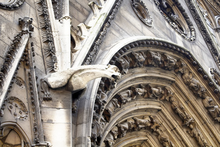 Architectural details of Notre Dame cathedral in Paris. Towering, 13th-century cathedral with flying buttresses & gargoyles, setting for Hugo's novel. Gargoyles are in the view.の写真素材