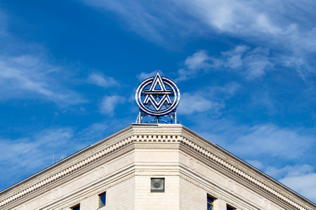 Amblem of The V&A Museum of Childhood in Moscow on top of the building with blue sky. It is a branch of the Victoria and Albert Museum, which is the United Kingdom's national museum of applied arts.のeditorial素材