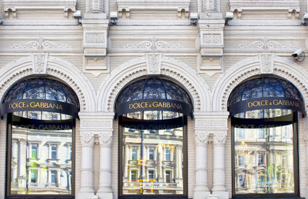 Famous fashion brand's store's windows with signage in Moscow city center. Ornamental, historical building showing architectural details.のeditorial素材