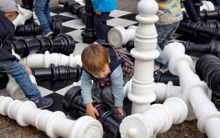 Children play giant chess at Moscow City Day Celebrations and Festival on Tverskaya street. Over a thousand events citywide are available to Muscovites.のeditorial素材
