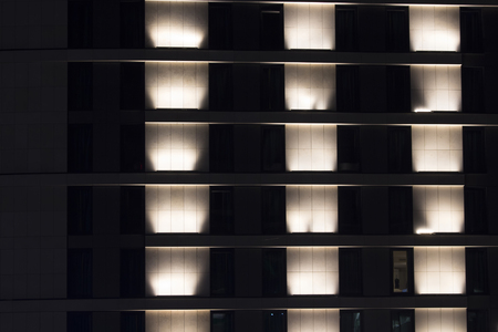 View of facade of a modern building at night.の写真素材