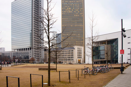View of city square surrounded by skyscrapers near Festhalle concert hall in Frankfurt.のeditorial素材