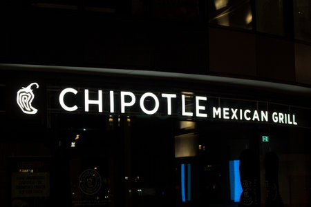 Night view of signage of a famous, international Mexican fast food brand's store in Frankfurt.のeditorial素材