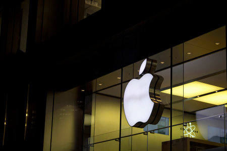 Night view of signage of American multinational technology company's store in Frankfurt.のeditorial素材