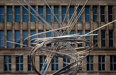 Modern city sculpture with a building in the background in Dusseldorf.のeditorial素材