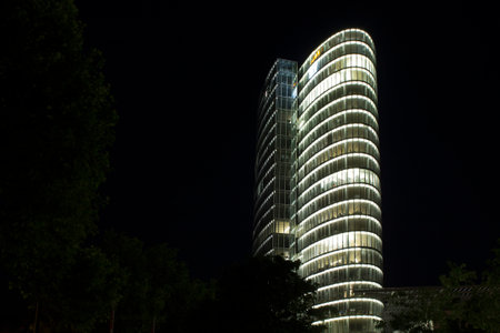 Night view of a modern skyscraper in Dusseldorf.のeditorial素材